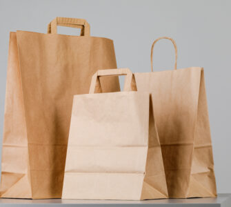 1brown paper bag with handles empty shopping bag with area your logo design food delivery concept