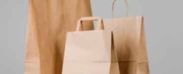 1brown paper bag with handles empty shopping bag with area your logo design food delivery concept