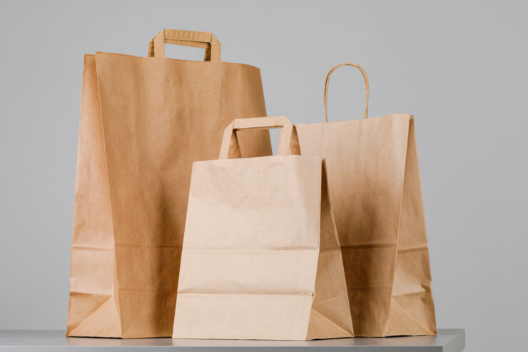 1brown paper bag with handles empty shopping bag with area your logo design food delivery concept