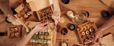 top view of table with sushi on it in paper eco bo 2025 03 18 20 59 34 utc