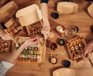 top view of table with sushi on it in paper eco bo 2025 03 18 20 59 34 utc