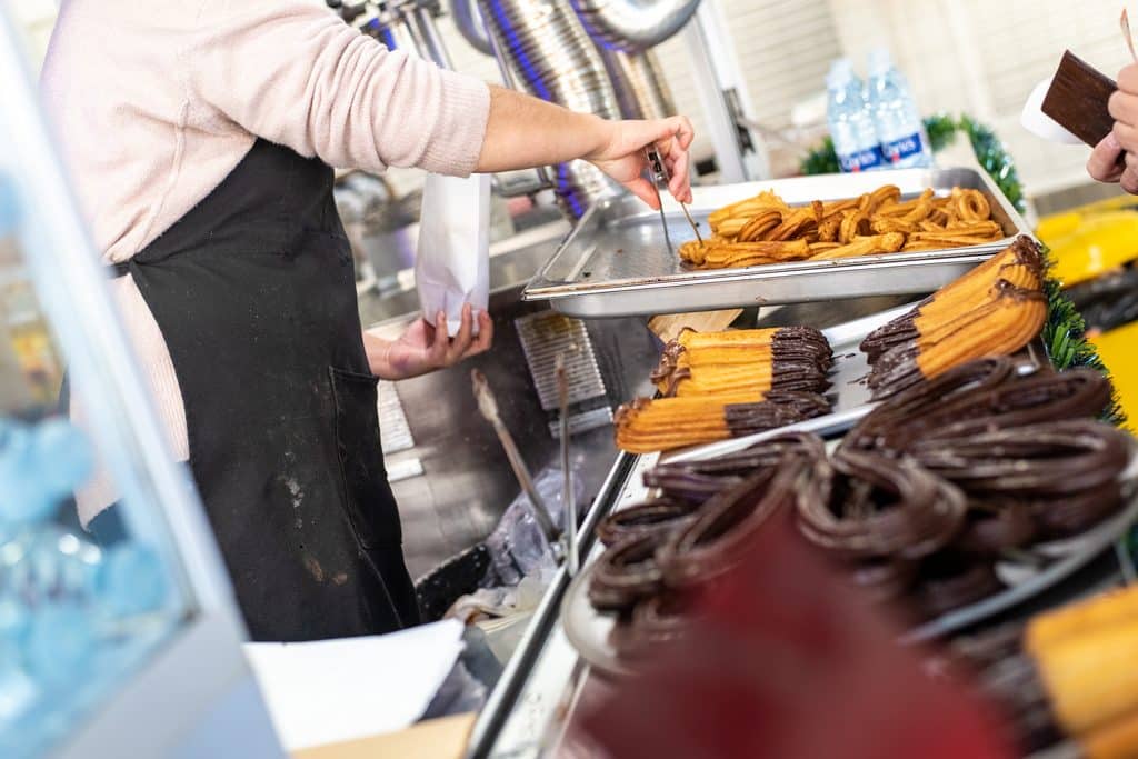 vendor selling churros at a street food stand 2026 09 24 00 22 06 utc